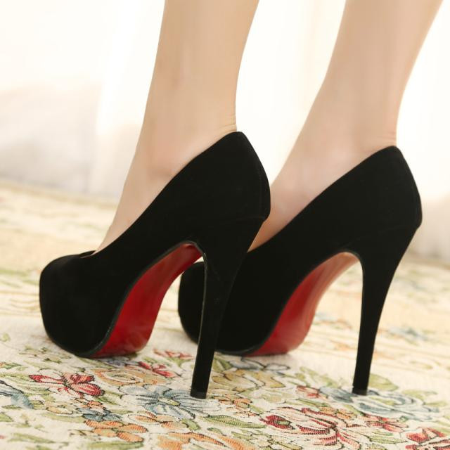 black shoes with red soles