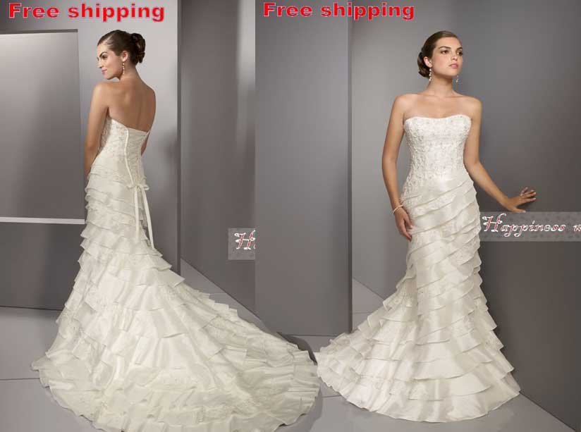 simple wedding dress with ruffles at end