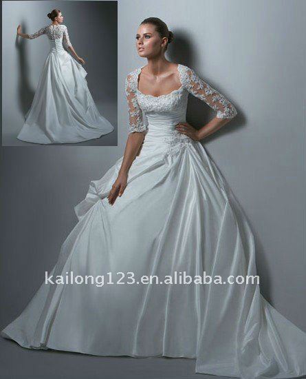 Elegant appliqued lace beading with jacket bridal gown